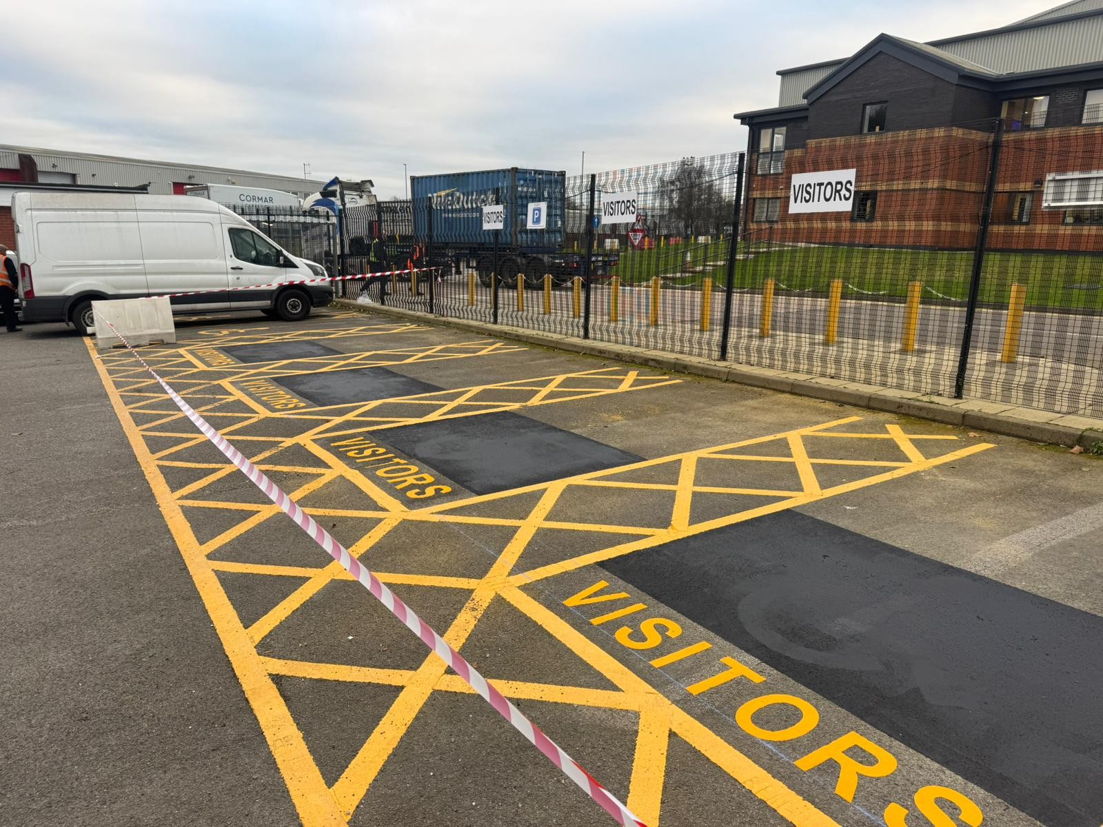 Visitor parking bays with yellow hatches